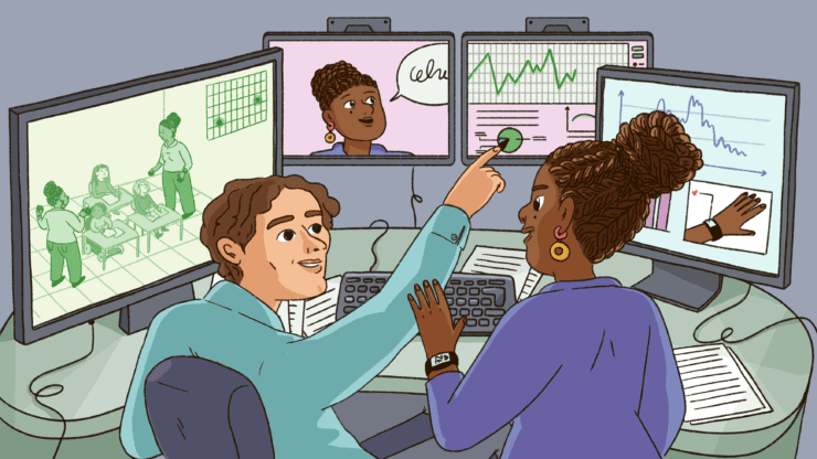 A teacher and researcher analyse data captured from the classroom.